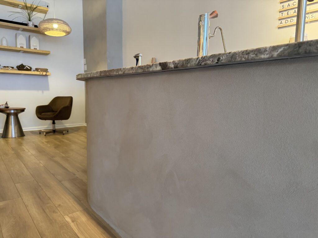 Concrete look microcement reception counter in an Ottawa office