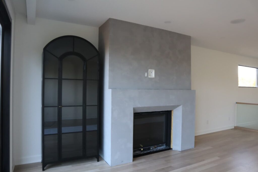 Microcement bathroom walls with arched mirror Ottawa