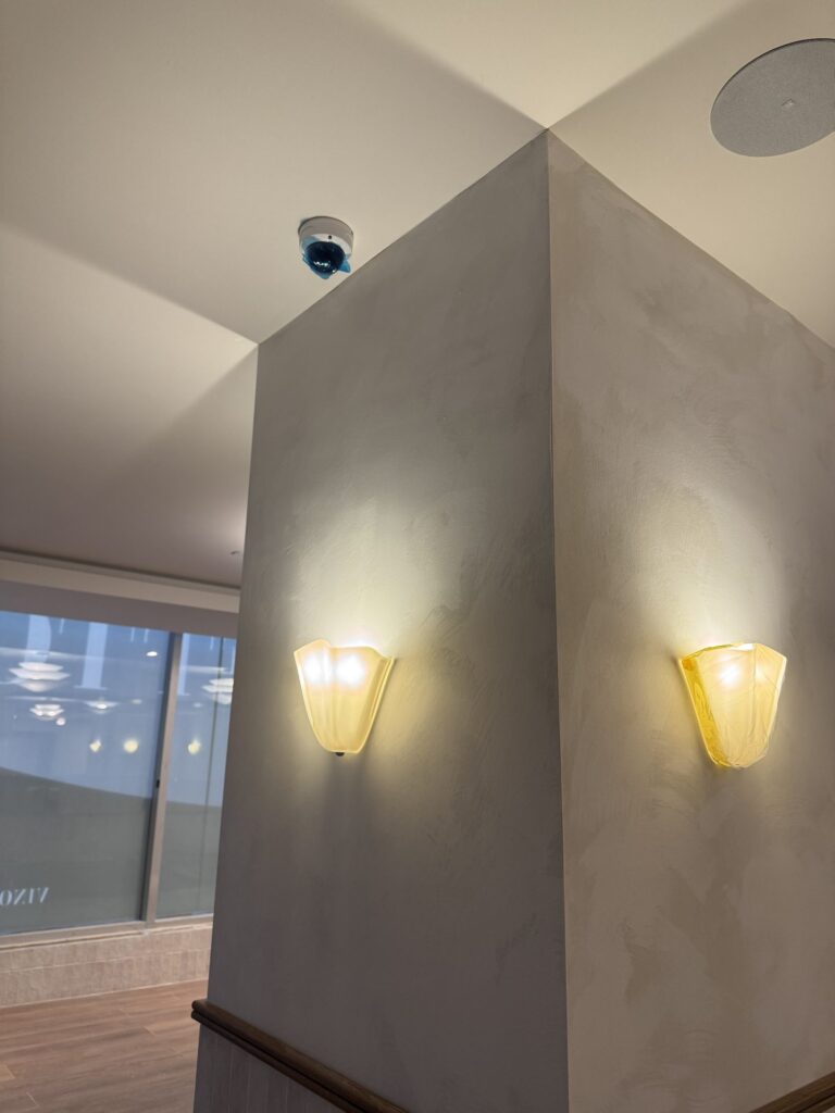 Stone toned feature column with vintage sconces, Ottawa