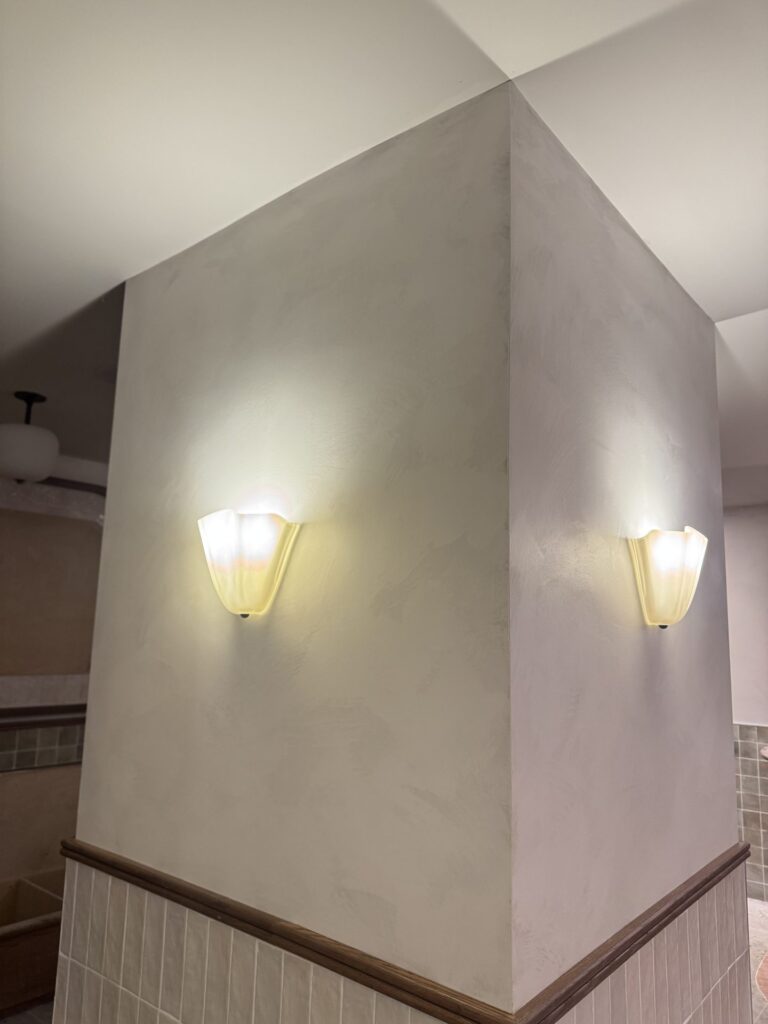 Lime plaster feature column with wall sconces, Ottawa