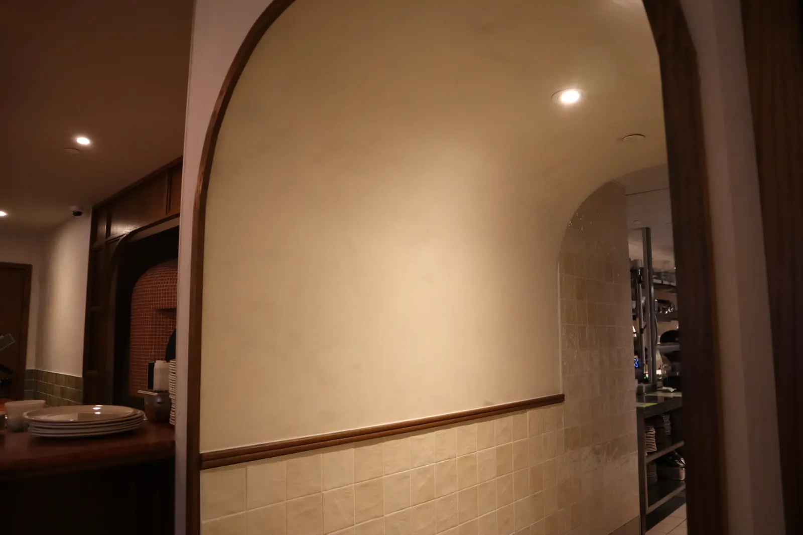 Smooth limewash arched passage to the kitchen at Carletto Ottawa