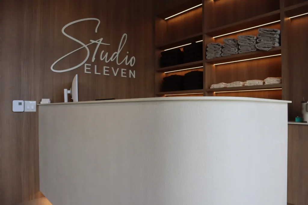 Hand-troweled microcement front desk at an Ottawa pilates studio